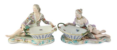 A pair of large Meissen figural bonbon dishes, 19th century, modelled as a lady and gentlemen in