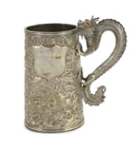 A 19th century Chinese silver mug, makers mark LC?, with dragon handle and embossed with
