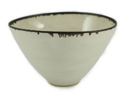 Dame Lucie Rie D.B.E. (1902-1995), a stoneware conical bowl, of slightly elliptical form, off