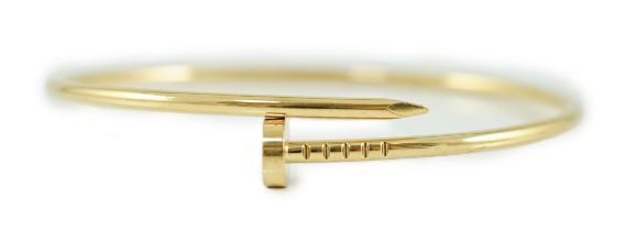 A modern 18ct gold Cartier Juste Un Clou bangle, signed, 10 grams.***CONDITION REPORT***Overall