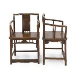 A pair of Chinese walnut armchairs, 19th century, the backs with central panel carved in relief with
