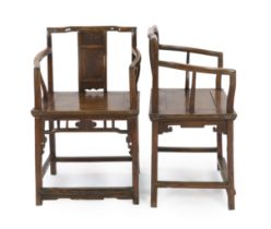 A pair of Chinese walnut armchairs, 19th century, the backs with central panel carved in relief with