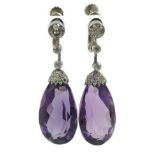 A pair of 1920's platinum?, single stone pear cut amethyst and millegrain round cut diamond set drop