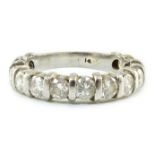 An 18ct white gold and thirteen stone round brilliant cut diamond set three quarter eternity ring,