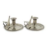 A pair of Victorian silver chambersticks and extinguishers, by Charles Thomas Fox and George Fox,