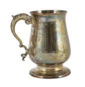 A George III silver baluster pint mug, by Peter & Ann Bateman, with acanthus leaf capped handle,
