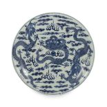 A Chinese blue and white ‘dragon’ dish, Kangxi mark, 19th century, finely painted with a central