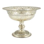 An Edwardian silver pedestal fruit bowl, with pierced border and pierced circular foot, by James