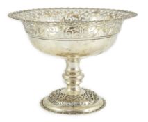 An Edwardian silver pedestal fruit bowl, with pierced border and pierced circular foot, by James