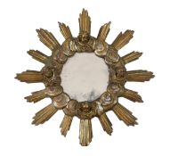 A Baroque Revival silvered and giltwood sunburst wall mirror with cherubs head’s decorations, 78cm