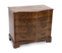 A George III mahogany serpentine dressing chest fitted four graduated long drawers, the top drawer