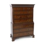 A George III mahogany chest on chest with dentil cornice and two short drawers over three