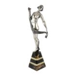 Henri Fugère (1872-1944). An Art Deco silvered bronze figure of a nude dancer standing upon a