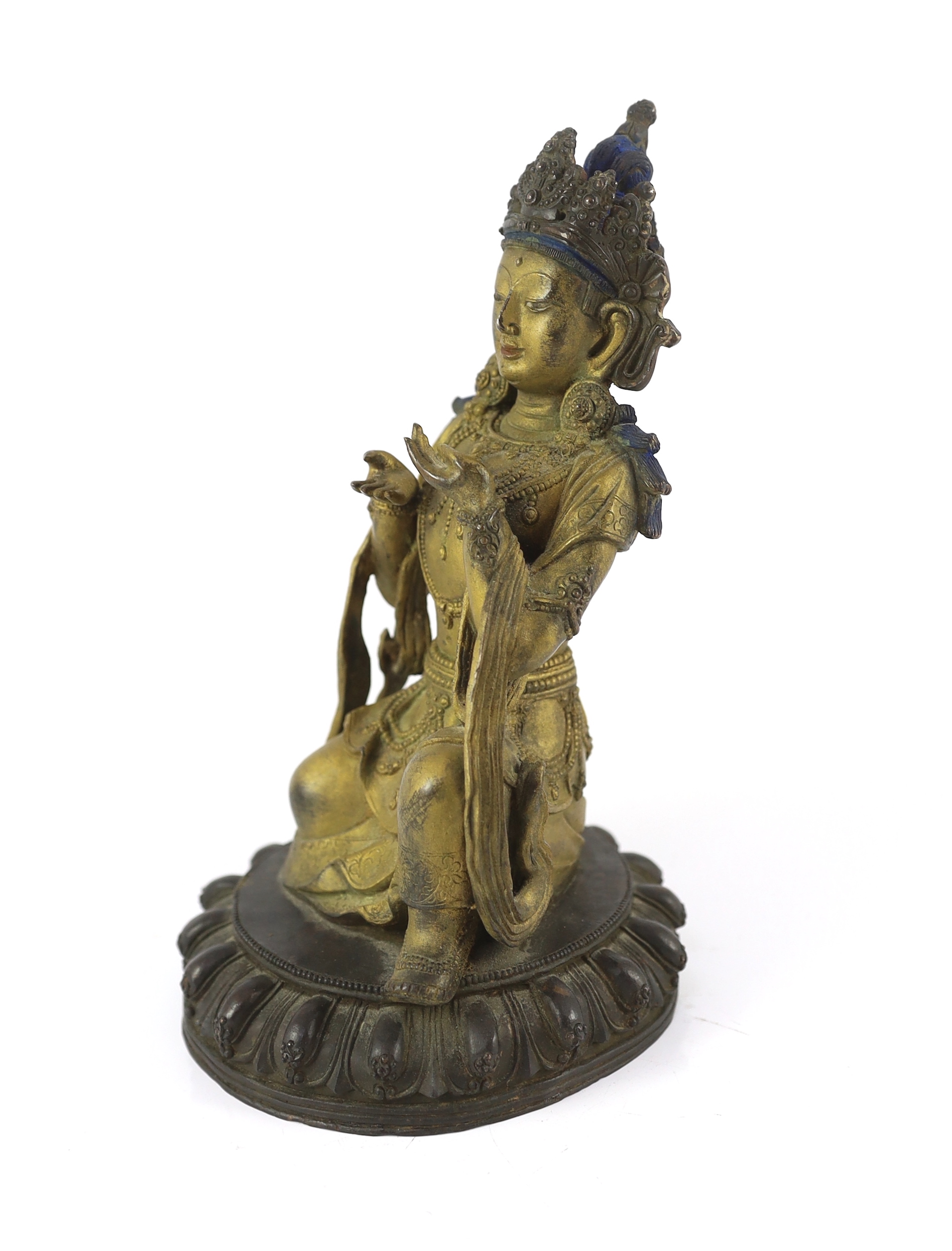A Chinese gilt bronze figure of a kneeling Bodhisattva, with remnants of polychrome decoration, on a - Image 2 of 4