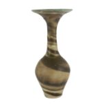 Dame Lucie Rie D.B.E. (1902-1995), a stoneware trumpet neck vase, covered in cream and dark brown