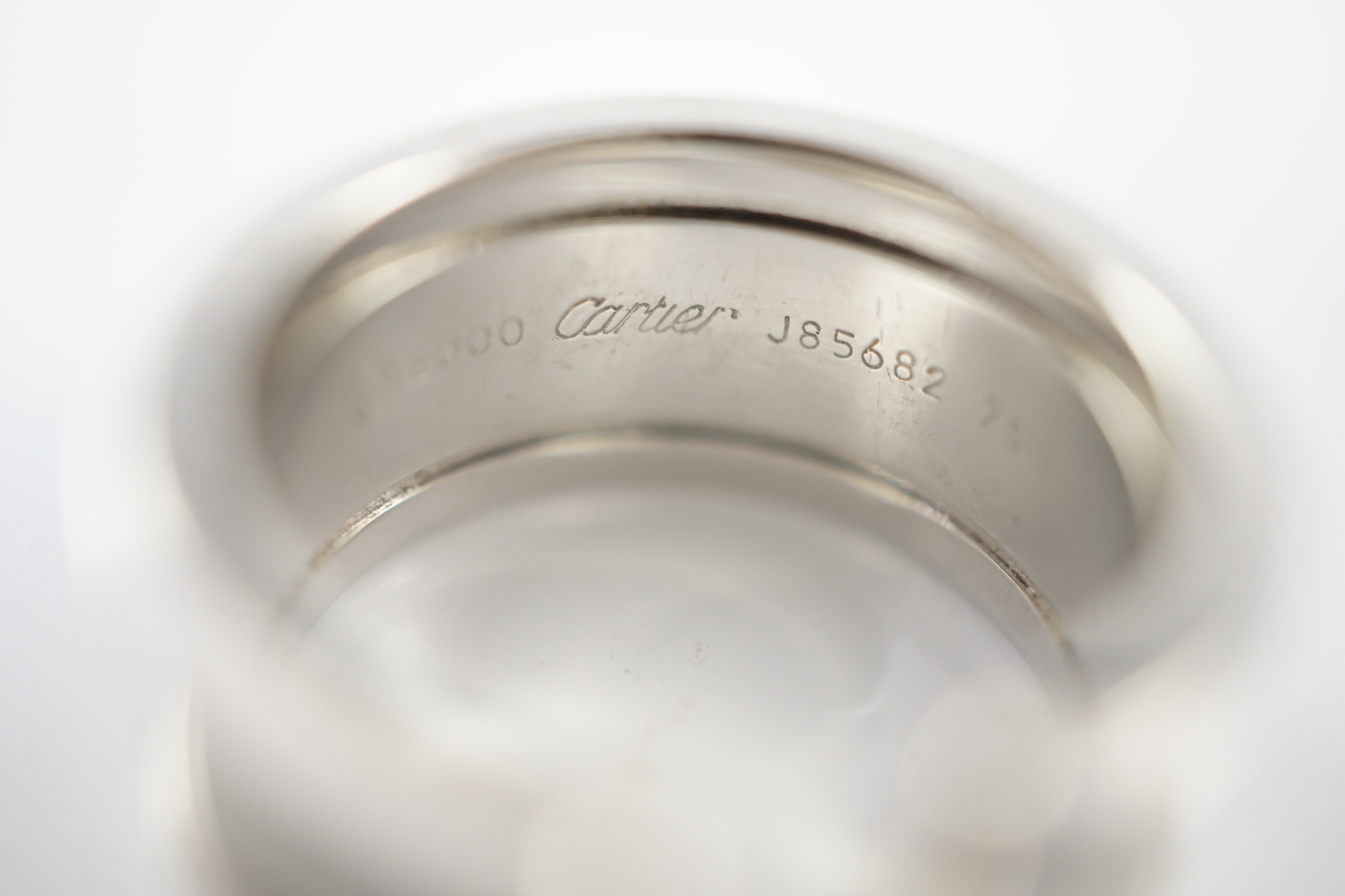 A modern Cartier part textured 18ct white gold openwork band, signed and numbered J 85682, size J, - Image 6 of 8