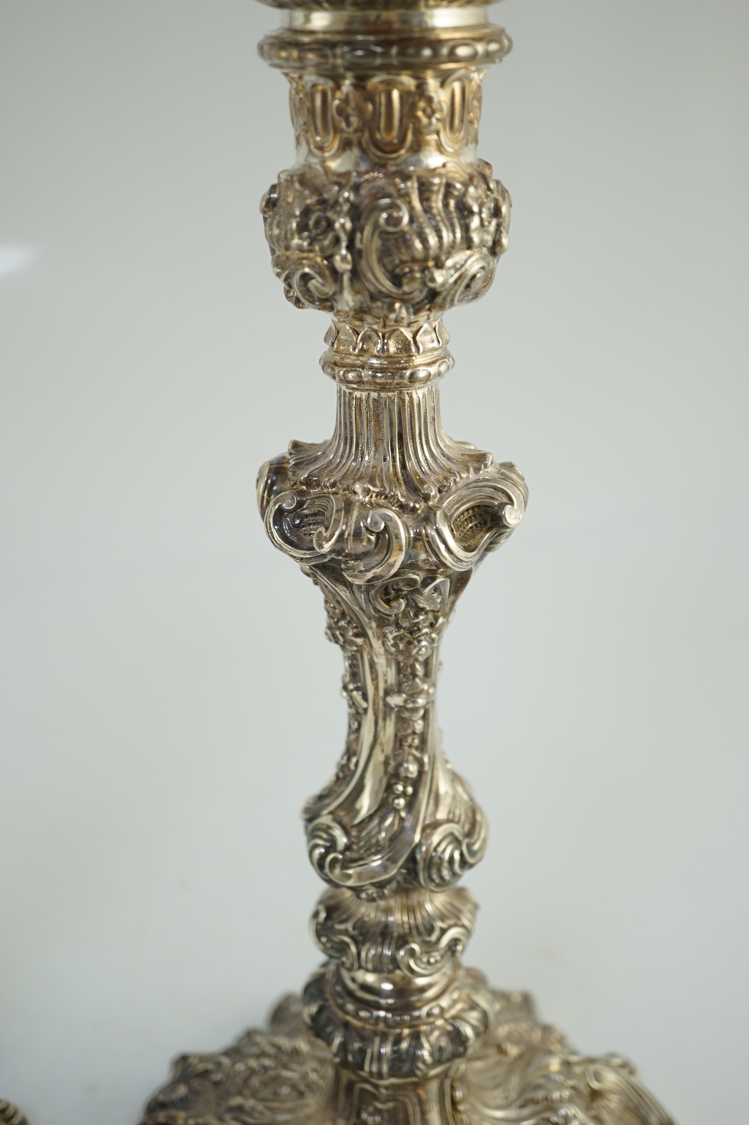 An ornate pair of Edwardian silver candlesticks, by Walker & Hall, with fixed sconces, waisted - Image 10 of 11