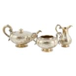 A Victorian silver three piece melon shaped tea set, by Charles Reily & George Storer, with engraved