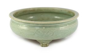 A large Chinese Longquan celadon ‘magnolia’ tripod censer, Ming dynasty, the compressed globular