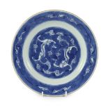 A Chinese blue and white ‘dragon’ plate, Kangxi period, painted with confronting dragons amid