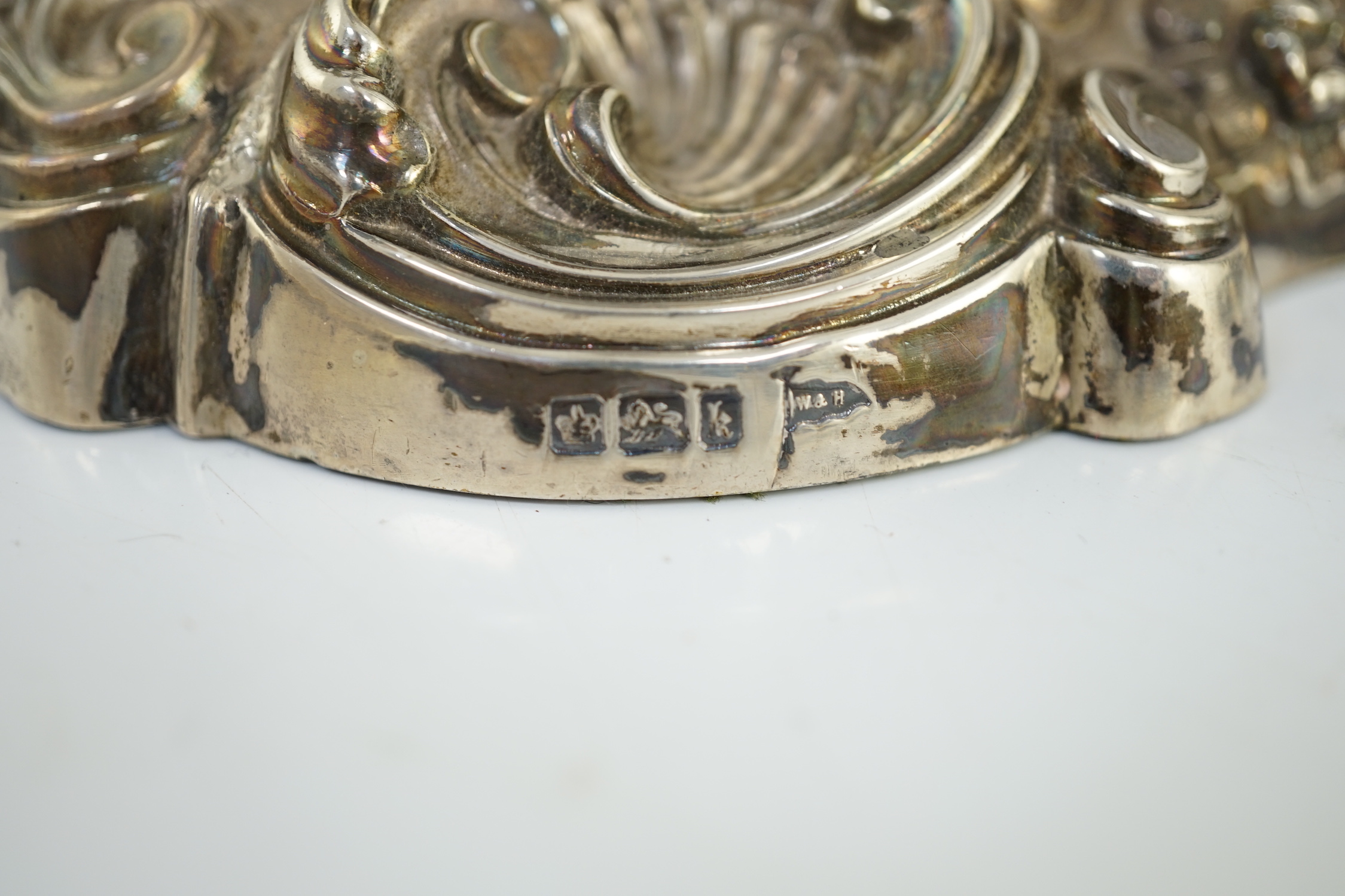 An ornate pair of Edwardian silver candlesticks, by Walker & Hall, with fixed sconces, waisted - Image 7 of 11