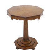 An early Victorian pollard oak occasional table with segmented octagonal top on tapered stem and