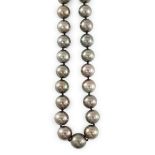 A modern Cartier single strand Tahitian pearl necklace, with 18ct gold and pave set diamond