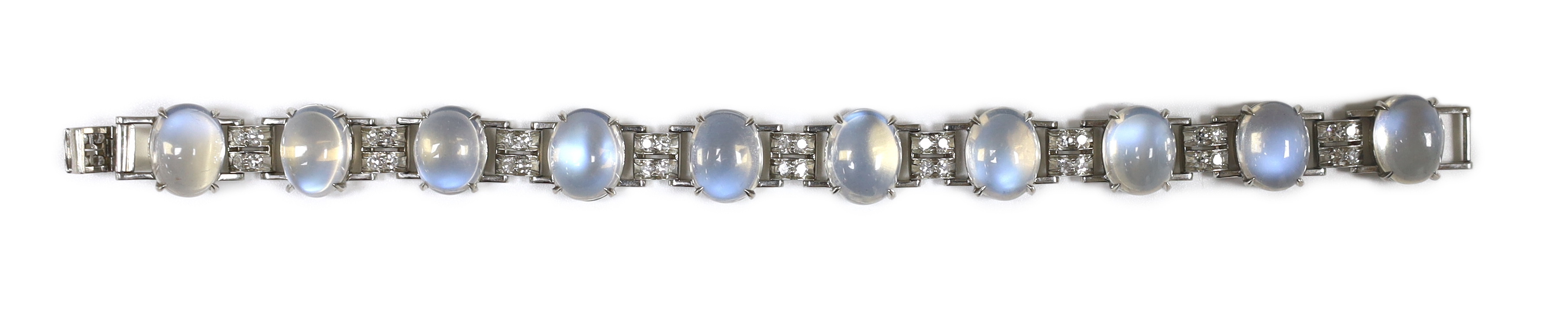 An early to mid 20th century platinum, moonstone and diamond cluster bracelet, set with ten cabochon