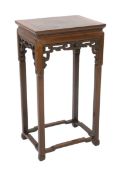 A Chinese Ming style hongmu jardiniere stand, 19th century, the rectangular framed panel top above a