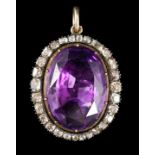 An early 19th century, gold and oval cut foil backed amethyst set pendant, with old cut diamond