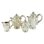 A mid 20th century Italian Buccelatti sterling silver four piece tea set, of fluted ovoid form,