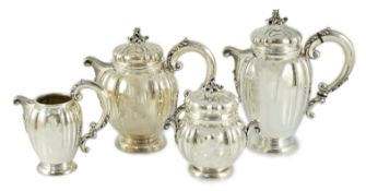 A mid 20th century Italian Buccelatti sterling silver four piece tea set, of fluted ovoid form,