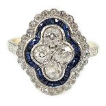 A modern 18ct gold, sapphire and diamond set quatrefoil shaped cluster ring, with a millegrain