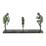 Philippe Matteau (Matto). An Art Deco bronze and marble group of three dancing pan pipers, on