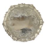 A George II silver salver, by John Robinson II, of shaped circular form, with later engraved