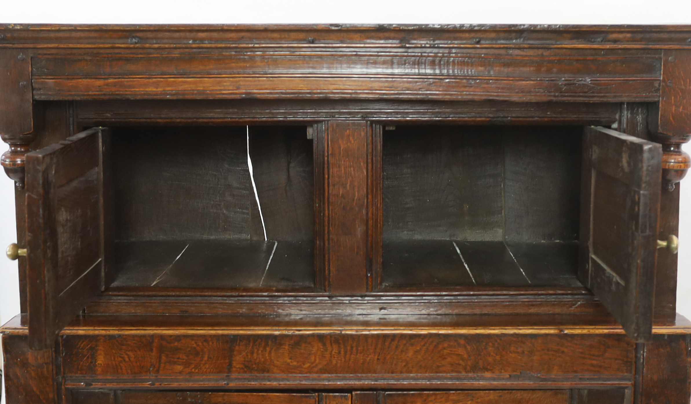 A 17th century oak court cupboard with moulded top and two panelled doors over two further - Image 3 of 4