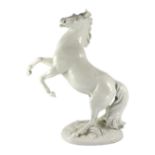 A large Meissen figure of a rearing stallion modelled by Eric Oehme, c.1949, signed, impressed