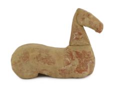 A Chinese buff pottery model of a horse, Han dynasty (206 BC-220 AD) painted in red and white