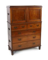 A Victorian teak campaign chest with press cupboard with two panelled doors enclosing a single shelf