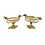 A graduated pair of 19th century Continental ormolu mounted mother of pearl pedestal bowls each