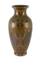 Attributed to Peter Behrens (German, 1868-1940). An Art Nouveau pottery and copper overlaid vase
