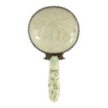 An early 20th century Chinese plated hand mirror with 18th/19th century jade mounts, the white