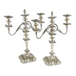 A pair of George VI silver two branch three light candelabra by George Howson, with reeded