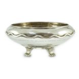 A George V Omar Ramsden planished silver shallow bowl, with wavy banded girdle engraved