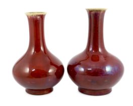 Two large Chinese flambé glazed bottle vases, 18th century, each covered in a purple streaked