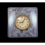 A Rene Lalique Inseparables opalescent glass desk timepiece, of square form, inset with the original