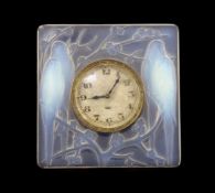 A Rene Lalique Inseparables opalescent glass desk timepiece, of square form, inset with the original
