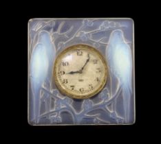 A Rene Lalique Inseparables opalescent glass desk timepiece, of square form, inset with the original