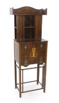 An early 20th century Arts & Crafts inlaid mahogany music cabinet, made by George Montague Ellwood