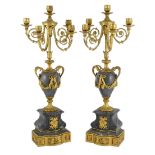 A pair of Louis XVI style ormolu and grey marble five light candelabra with scrolling branches and